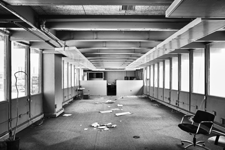 Abandoned office interior, showing debris and hazards linked to urbex trespassing.