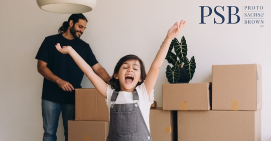 father and child moving into a new home